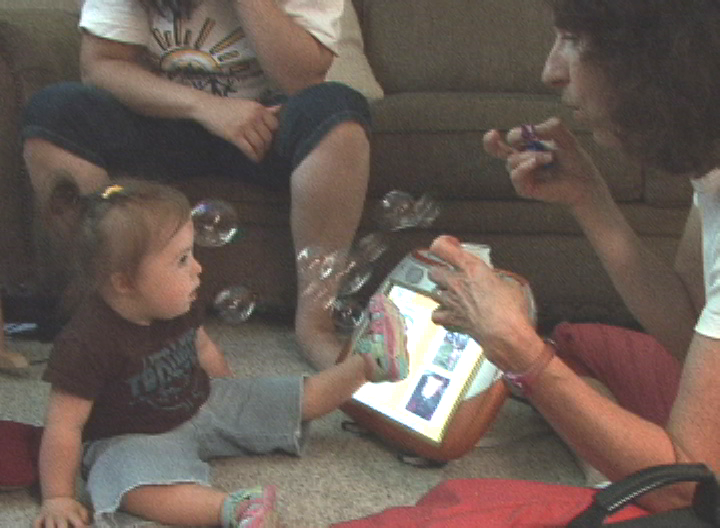 EM enjoys playing bubbles with Janice.