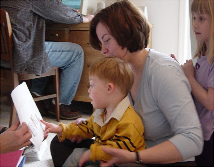 Gabe uses picture symbols to communicate with his mom and sister.