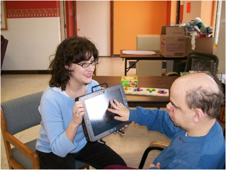 Older communicators: JF and Kathy use AAC to share a conversation.